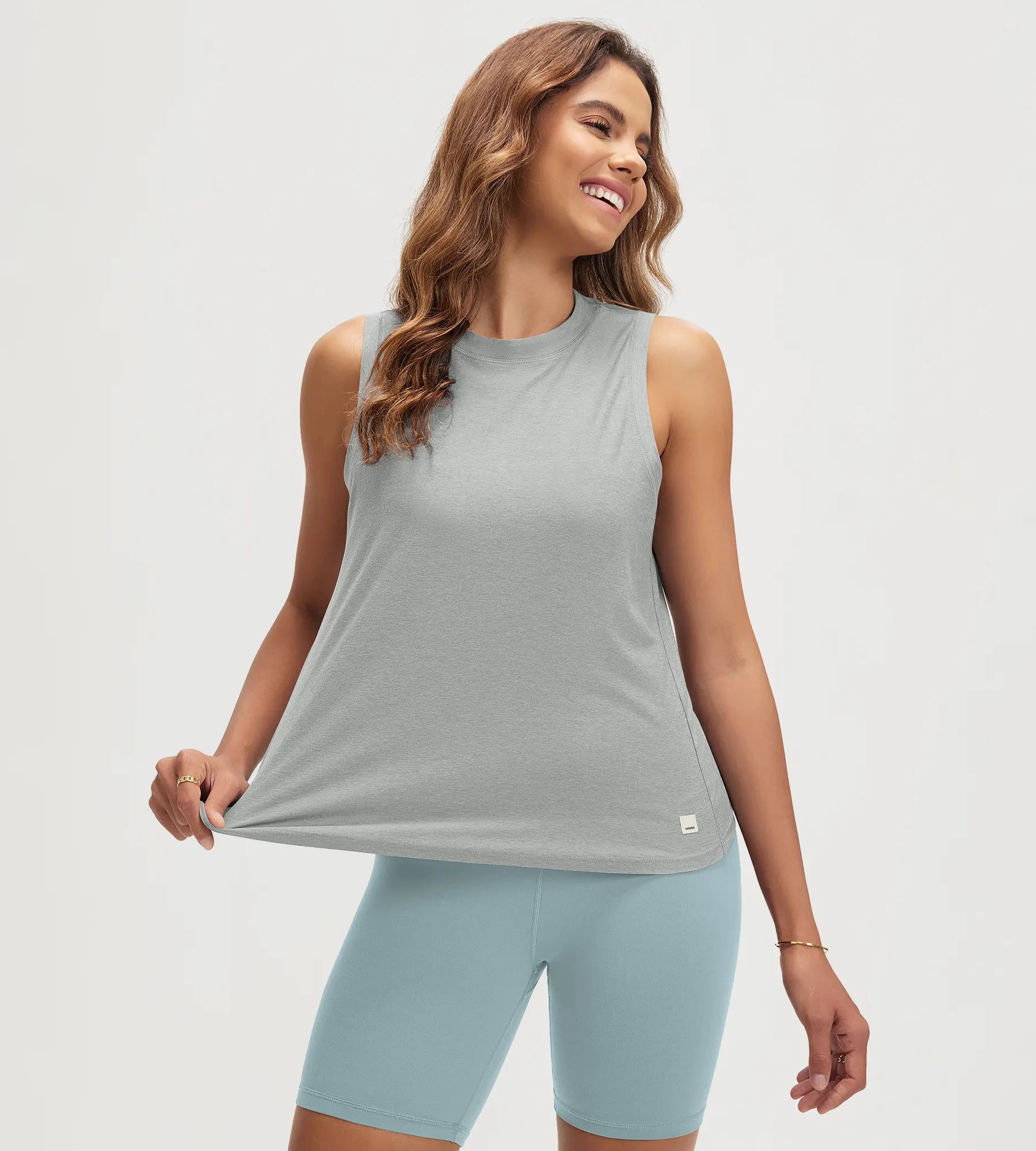 ODODOS Stratum Women's Performance Tank in gray with breathable fabric and athletic fit.
