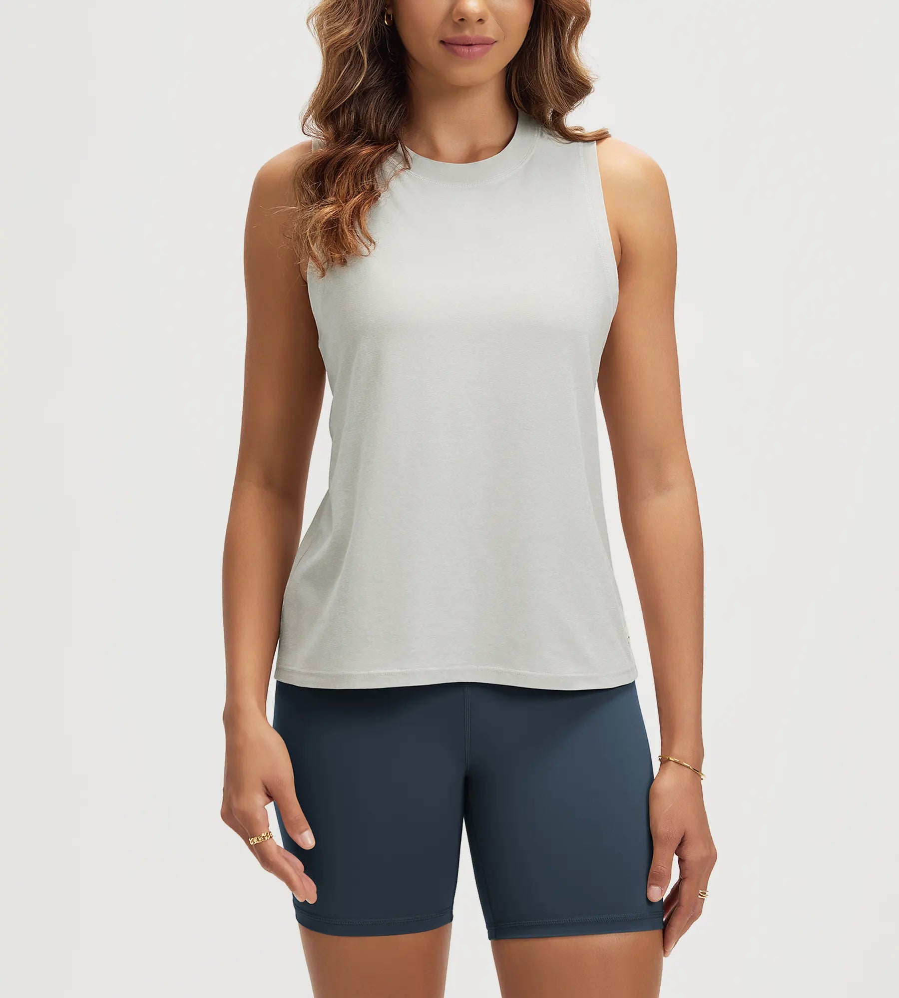 ODODOS Stratum Women's Performance Tank in soft fabric with athletic fit, paired with mock neck design.