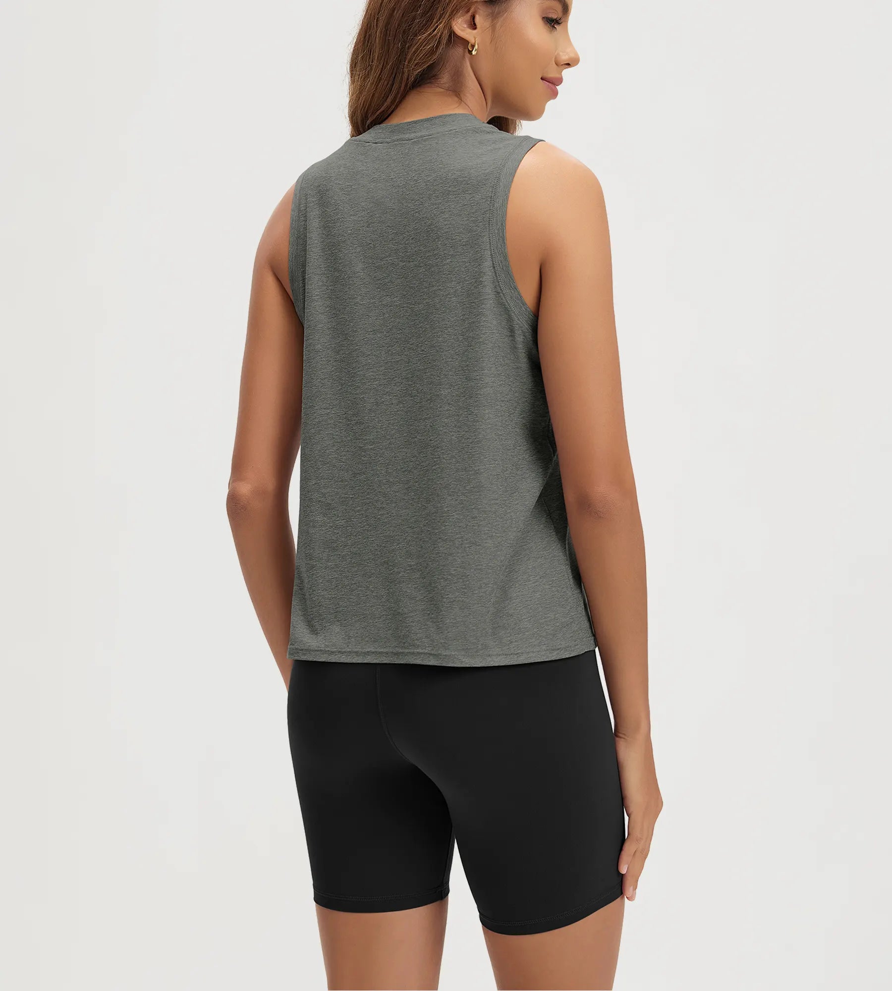 ODODOS Stratum Women's Performance Tank in gray, showcased with black workout shorts.