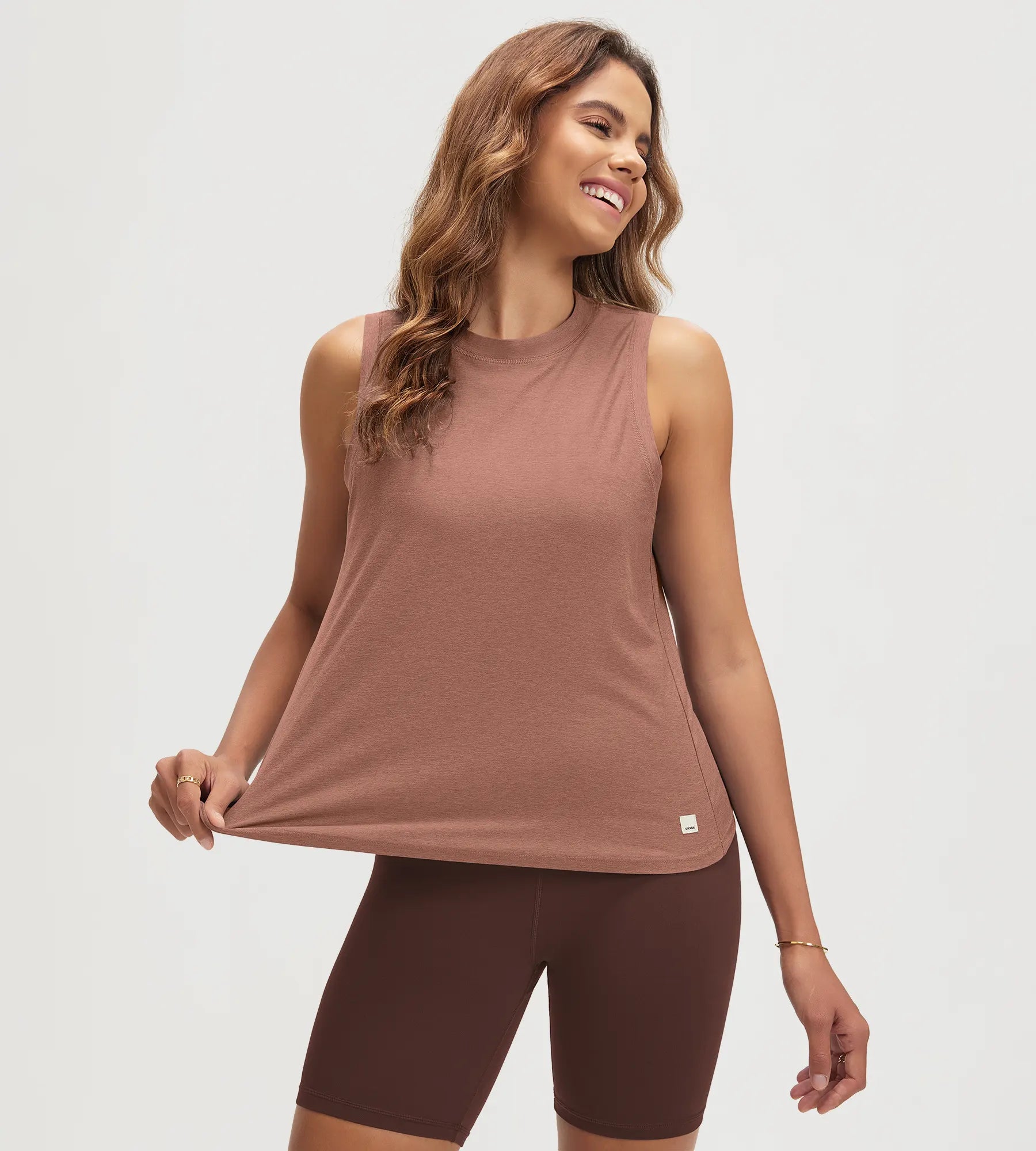 ODODOS Stratum women's performance tank with breathable soft fabric and loose fit.
