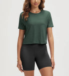 ODODOS Stratum Women's Performance Cropped Tee in soft fabric, paired with athletic fit shorts.
