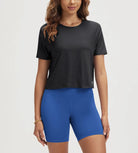 ODODOS Stratum Women's Performance Cropped Tee paired with breathable blue workout shorts.