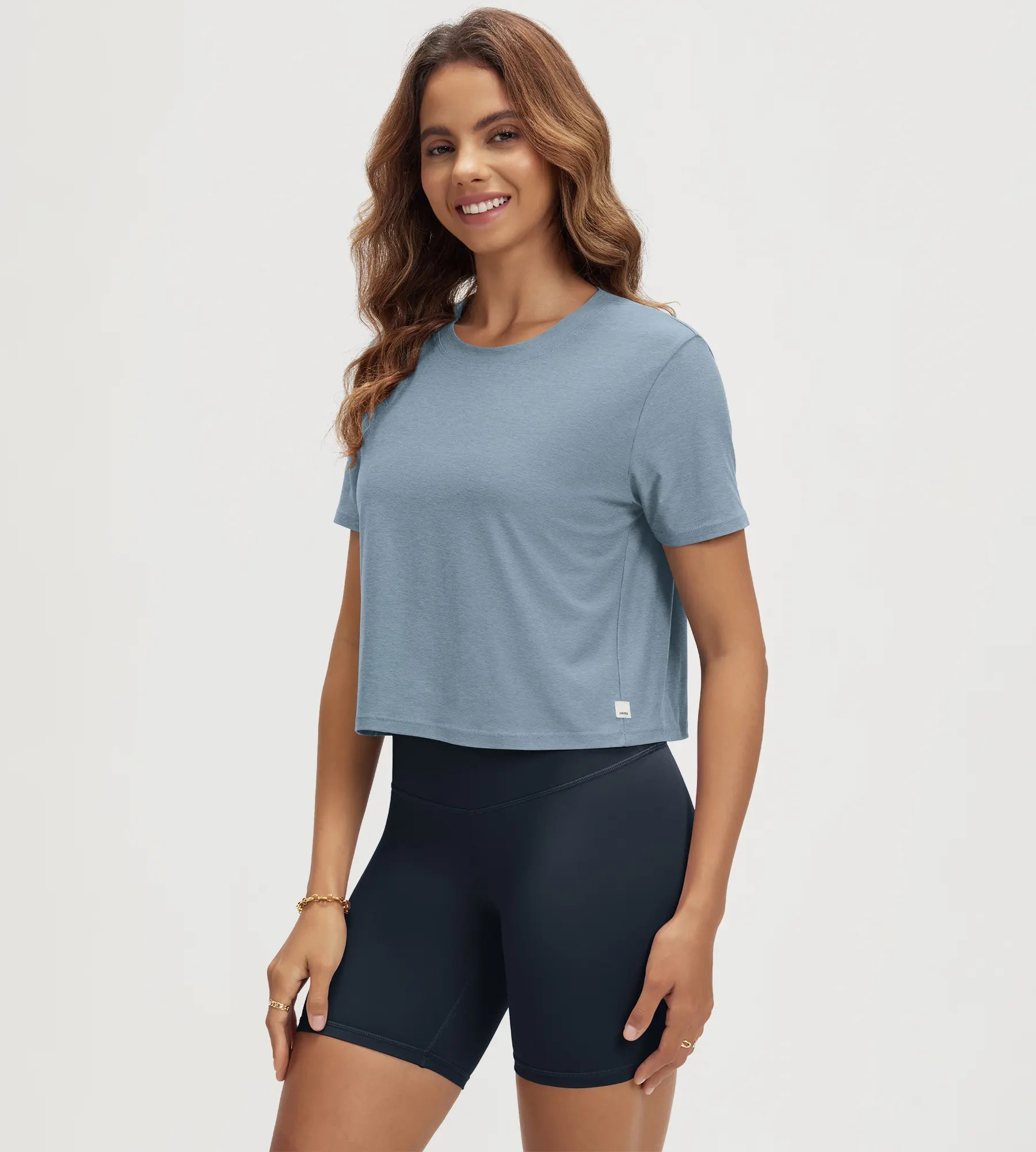 ODODOS Stratum Women's Performance Cropped Tee in soft fabric, perfect for workout wear.