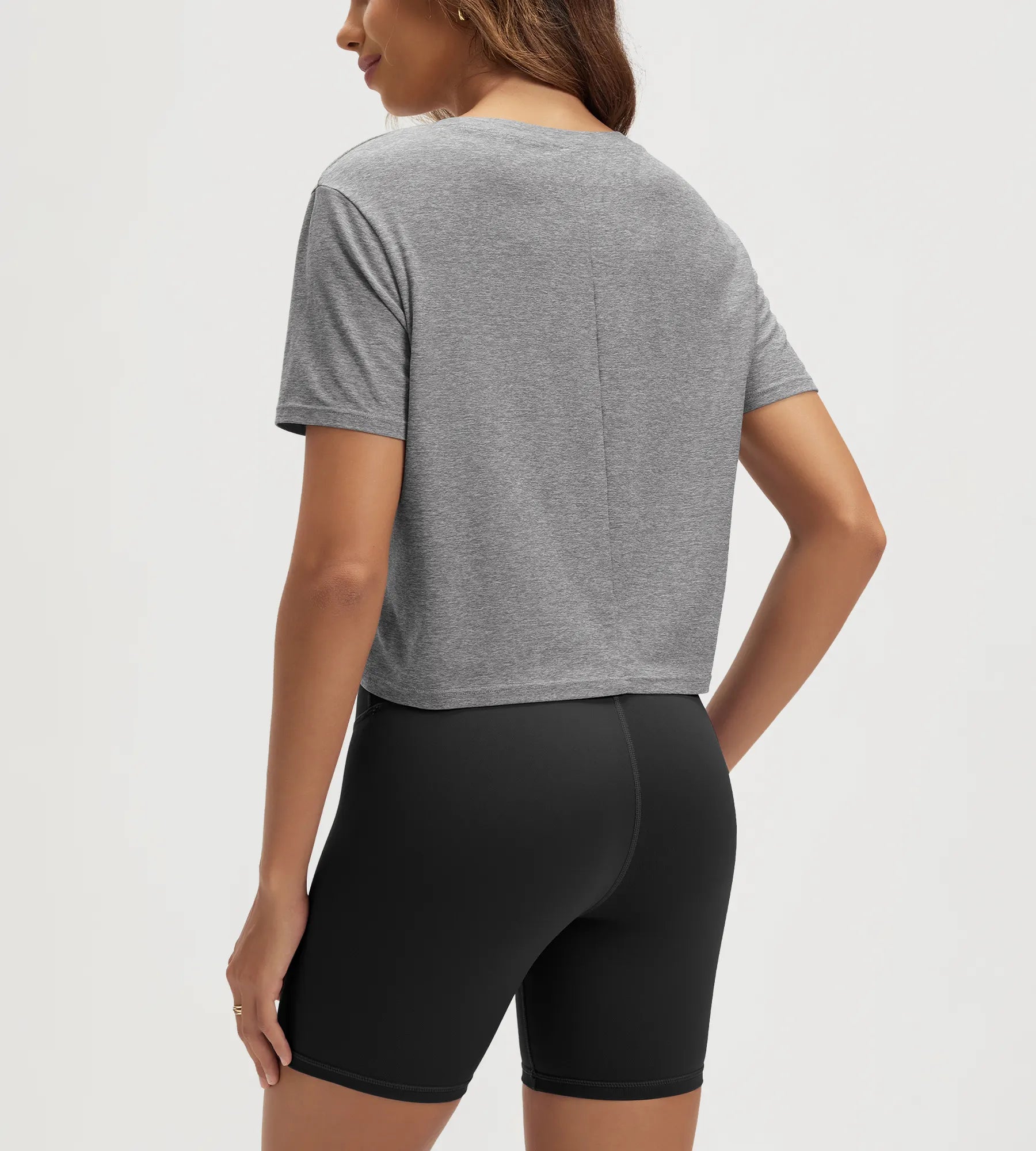 ODODOS Stratum Women's Performance Cropped Tee with soft fabric, paired with fitted athletic shorts.