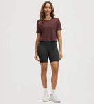ODODOS Stratum Women's Performance Cropped Tee in soft fabric with workout shorts.