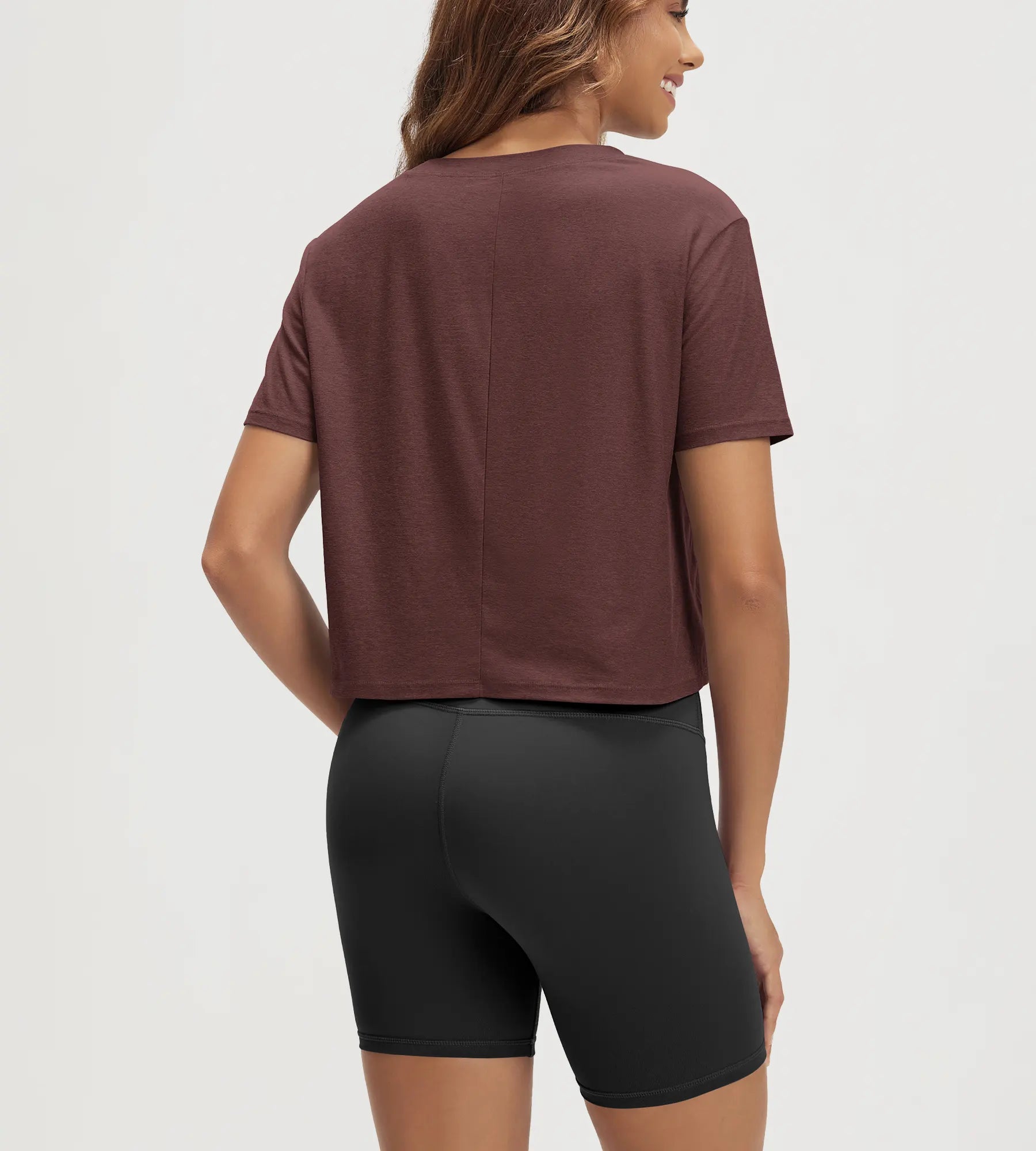 ODODOS Stratum Women's Performance Cropped Tee with quick dry shorts, showing athletic fit and soft fabric.