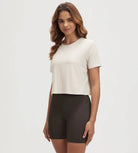 ODODOS Stratum cropped tee for women, soft fabric, perfect for workout wear.