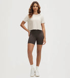 ODODOS Stratum Women's Performance Cropped Tee paired with workout shorts for an athletic fit.