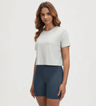 ODODOS Stratum Women's performance cropped tee with soft fabric, perfect for workout wear.