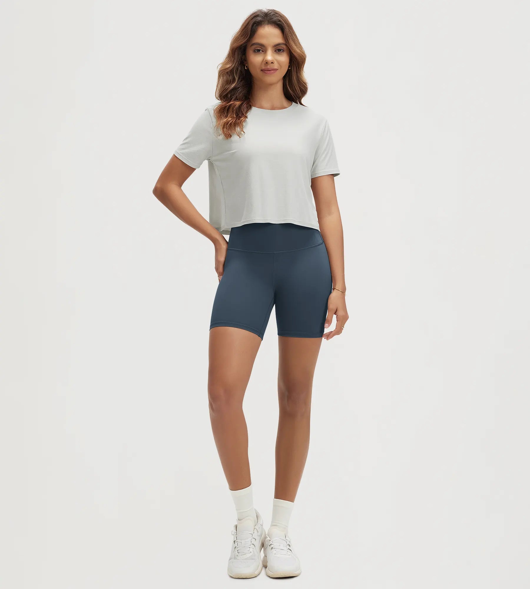 ODODOS Stratum women's performance cropped tee paired with high-waisted shorts.
